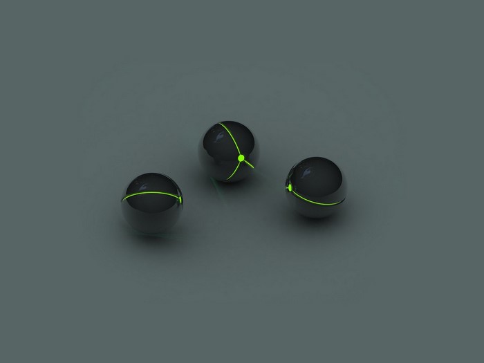 Three black spheres with green lines on a gray background