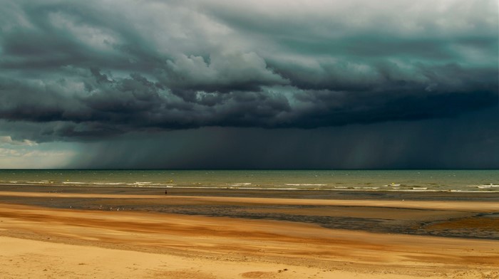 Stormy sky over a beach and ocean
