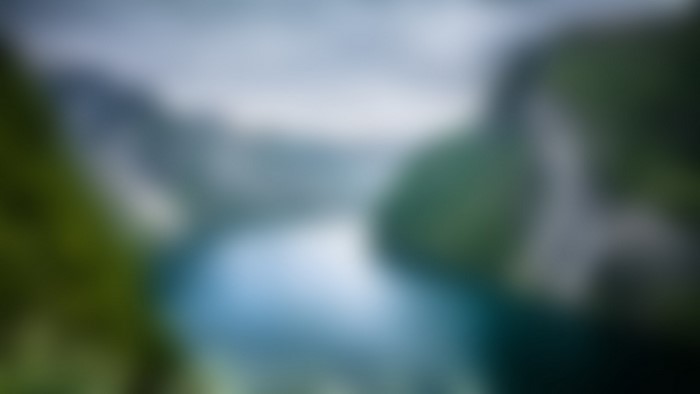 Blurred river and trees in soft light