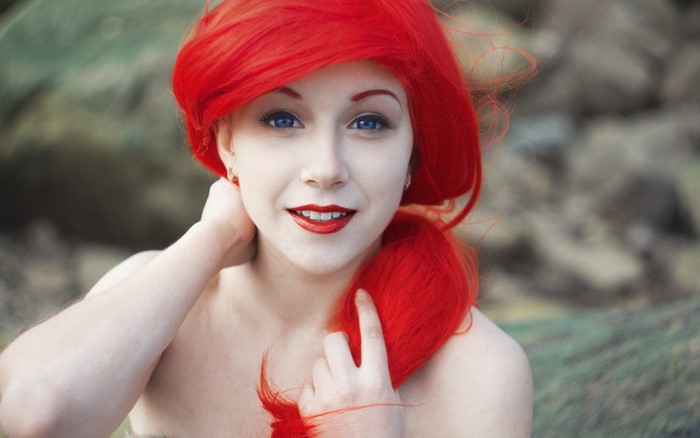 Portrait of Woman with Vibrant Red Hair and Blue Eyes