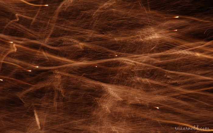 Abstract light streaks on brown texture