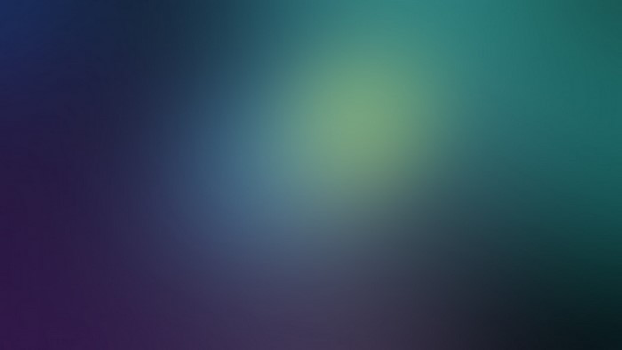 Abstract gradient of deep blue and teal with a bright yellow glow