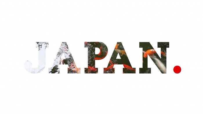 The word JAPAN with koi fish and a red dot