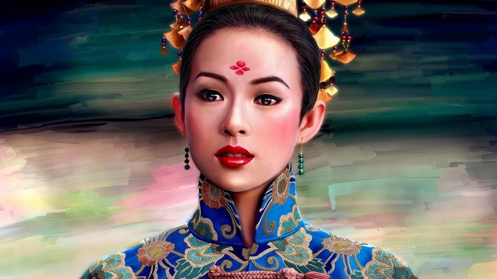 Woman in traditional blue and gold dress with ornate headdress
