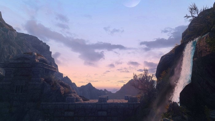 The Elder Scrolls V Skyrim landscape with waterfall and ancient ruins