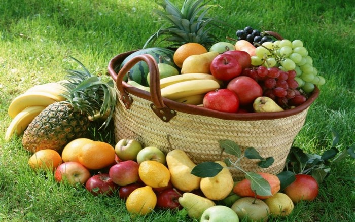Basket of Fresh Fruits on Green Grass