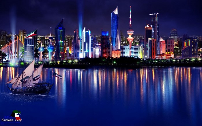 Kuwait City skyline at night with a traditional boat
