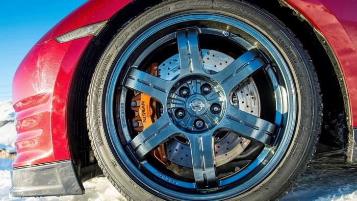 Nissan GT-R sports car wheel with orange brake caliper