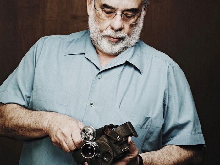 Francis Ford Coppola holding a vintage camera