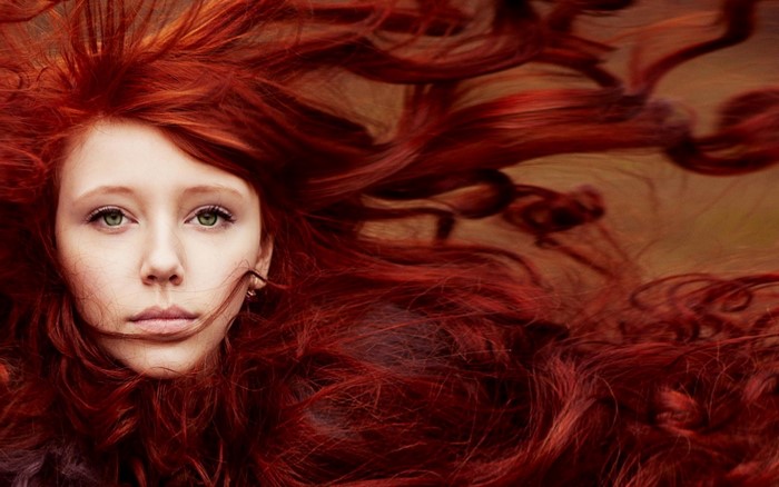 Windy Portrait of a Redhead Woman with Green Eyes