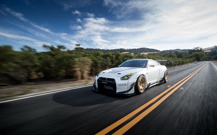 White Nissan GT-R driving on a road