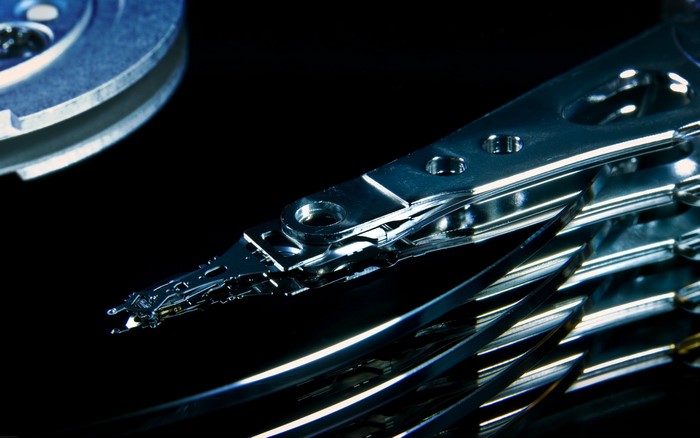 Close-up of a hard drive read/write head and platters