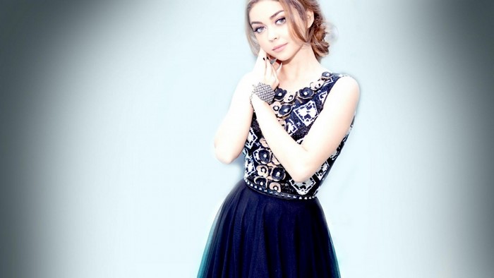 Sarah Hyland in a patterned dress and black skirt