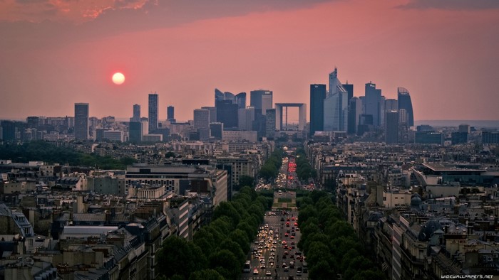 Paris cityscape at sunset with La Defense skyline