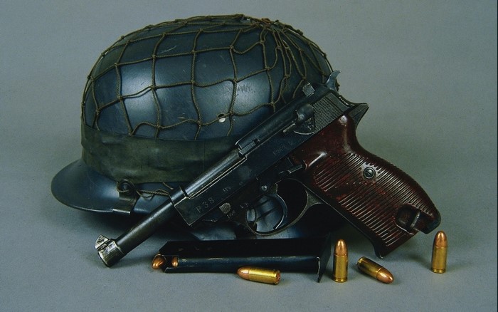 Walther P38 pistol with ammunition and helmet
