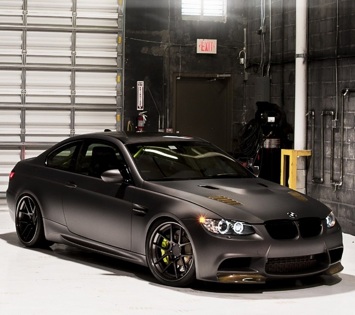 Matte Black BMW M3 Coupe in a Garage