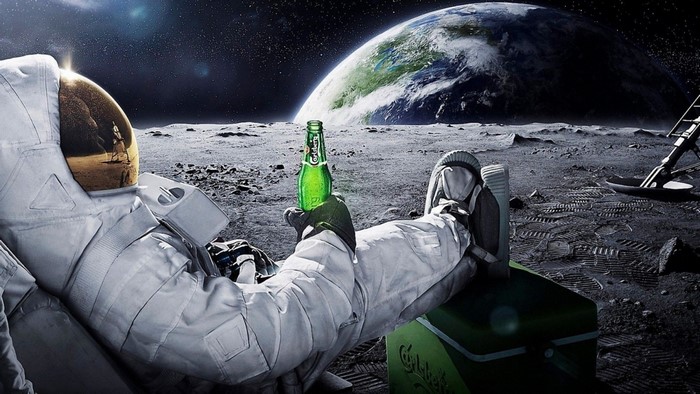 Astronaut Relaxing on Moon with Carlsberg Bottle