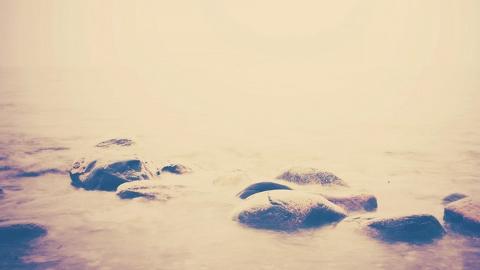 Rocks in the water with fog