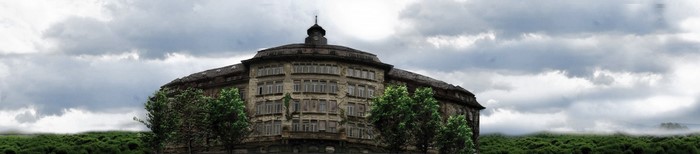 Old abandoned building with a tower and trees
