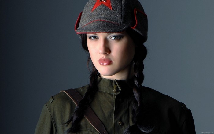 Woman in Soviet uniform and hat with red star