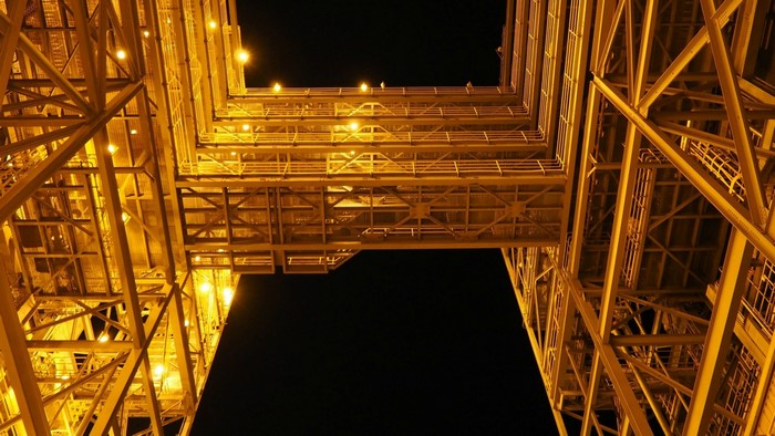 Illuminated industrial structure at night