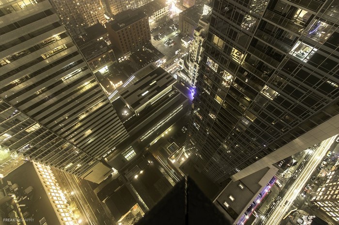 Aerial view of a city at night with skyscrapers