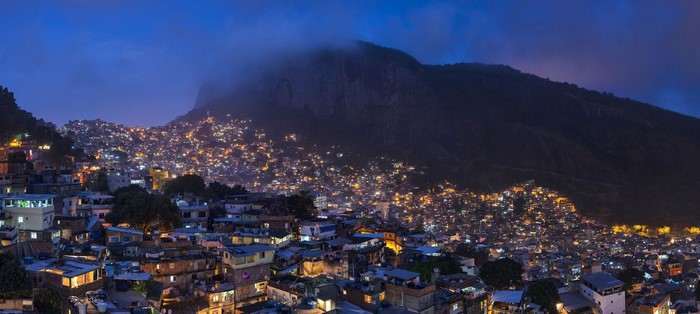 Rio de Janeiro favela at dusk with mountain backdrop