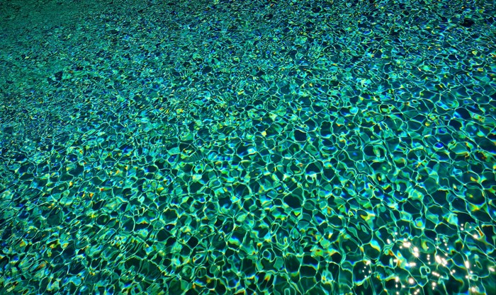 Sunlight on rippling turquoise water