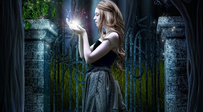 Girl holding magic light near gate