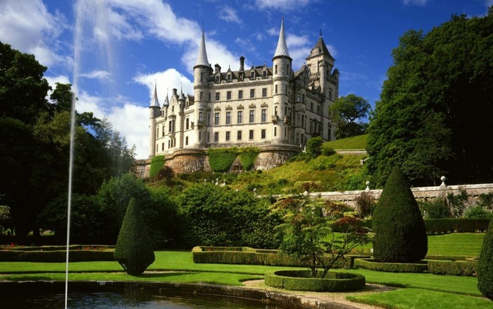 Elegant Castle on a Sunny Day with Manicured Gardens