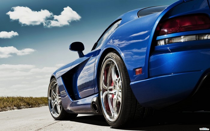 Blue Dodge Viper sports car on a road