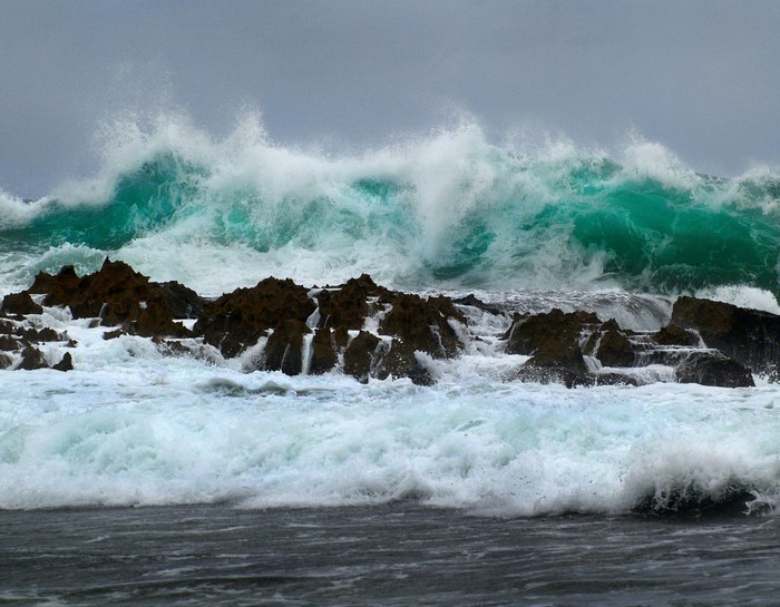Waves crashing on rocky shore