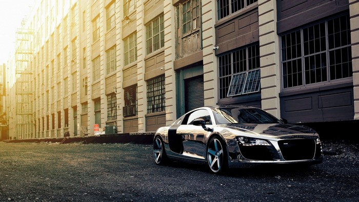 Chrome Audi R8 parked in an urban alleyway