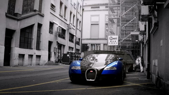 Blue Bugatti Veyron parked in alley