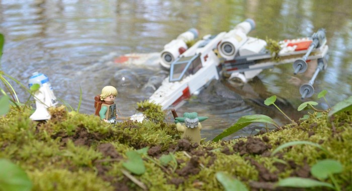 Luke Skywalker, R2-D2, and Yoda with crashed X-wing in water