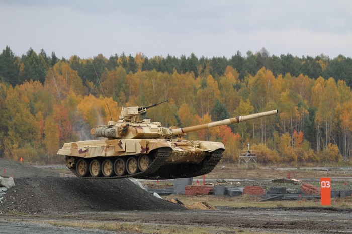 T-90 tank jumping over an obstacle