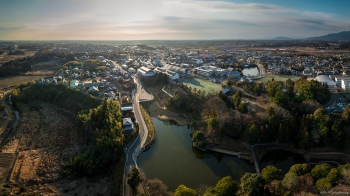 Aerial panorama of a Japanese town with a lake