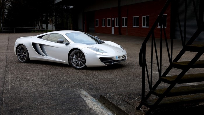 White McLaren MP4-12C parked on asphalt