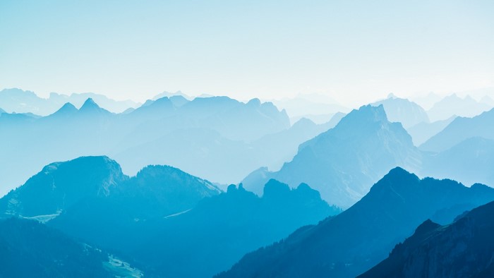 Blue mountain range under a clear sky