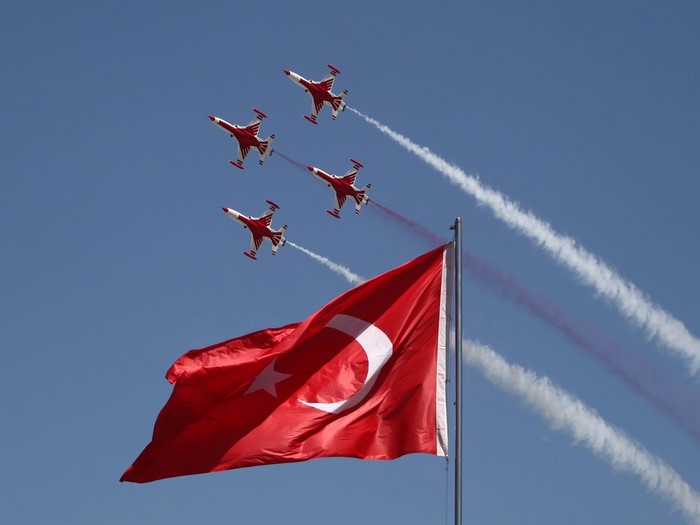 Turkish Stars aerobatic team flies over Turkish flag