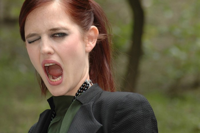 Eva Green winking and yawning with open mouth