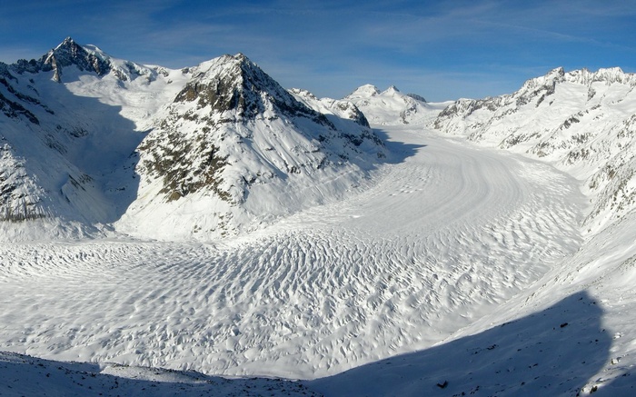 Snowy mountain range with a large glacier