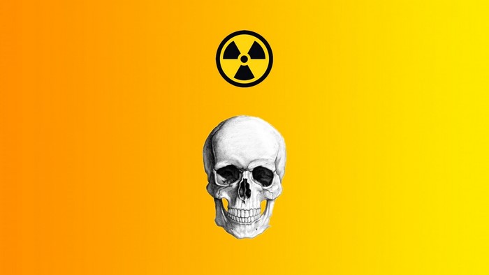 Skull and radioactive symbol on yellow background
