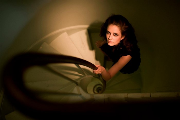 Eva Green on a spiral staircase