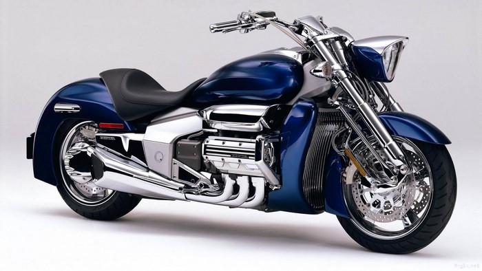 Blue Honda cruiser motorcycle with chrome accents