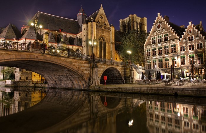 Gent Nightscape with Historic Bridge and Canal Reflection