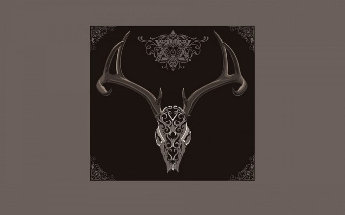 Deer skull with ornate carvings and antlers