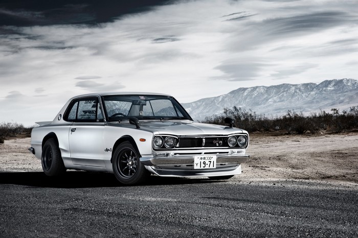 Silver Nissan Skyline Hakosuka 2000GT in desert landscape