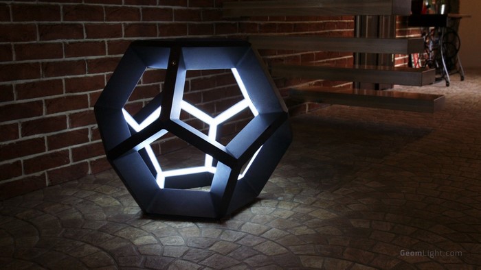Geometric Lamp with White Lights on Stone Floor