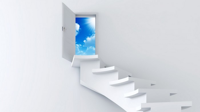 White stairs leading to an open door with a bright sky
